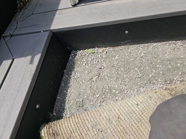 Artificial grass edge detail showing clean transition to stone base